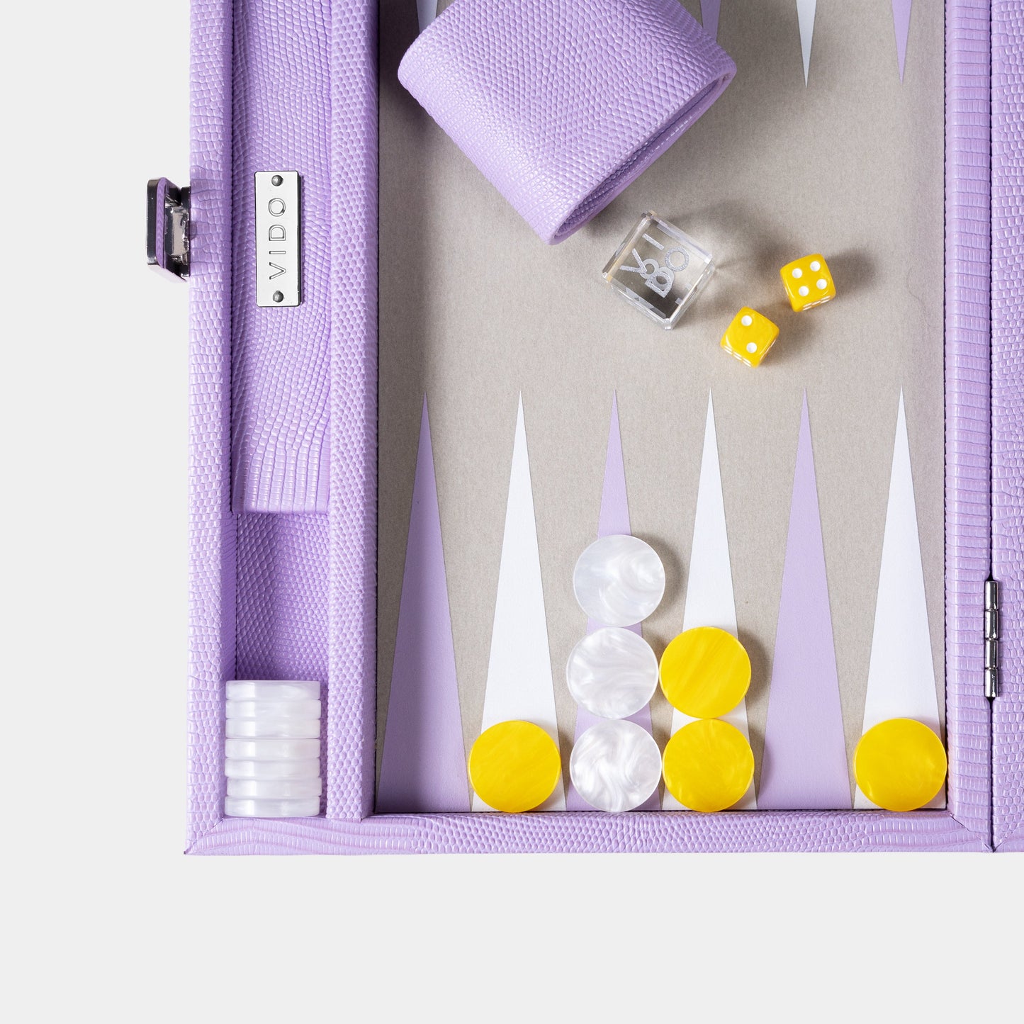 Purple backgammon set with pieces and dice on a white background by VIDO